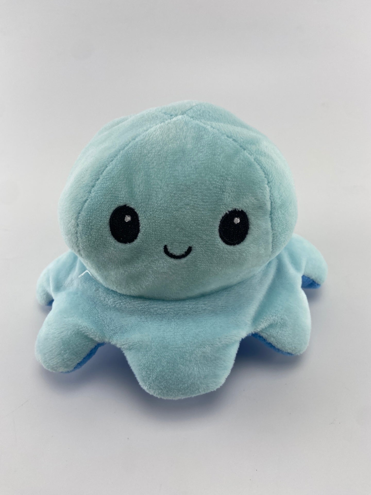 Polvo peluche dupla face