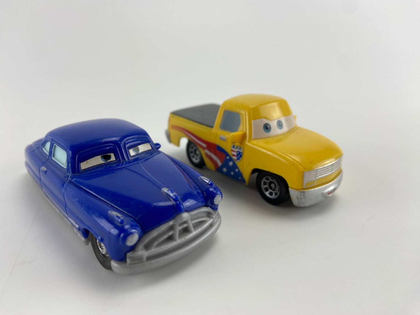 DISNEY Doc Hudson e John Lassetire do Filme McQueen